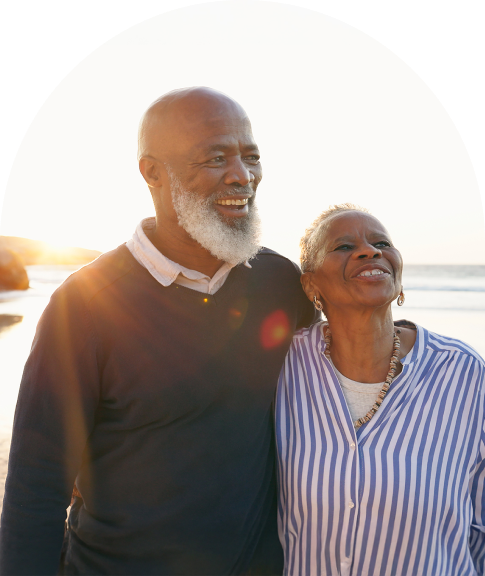 older couple walking in an embrace
