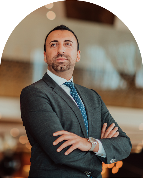 man in a suit with his arms crossed